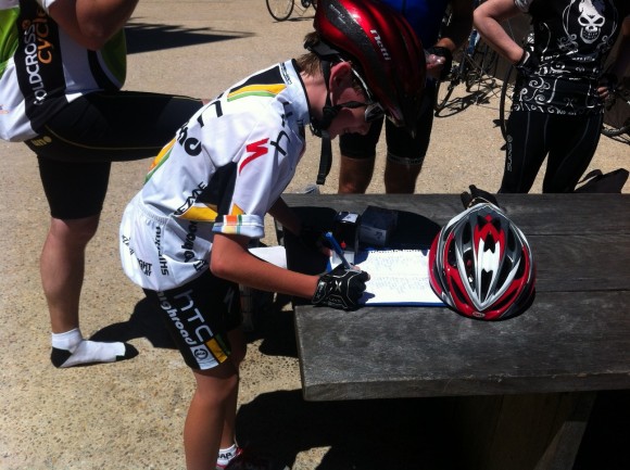 12-year-old Tristan Hocking-Brown signs in after finishing the climb.