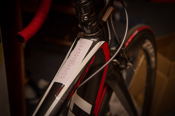 Race numbers on the top tube to know who to watch for.