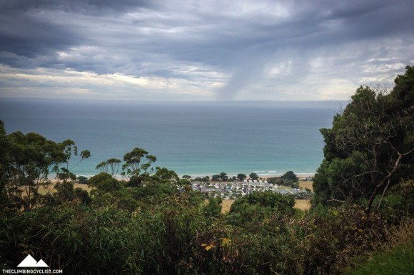 View from the Marriners Lookout Road, with rain bearing down on the coast.